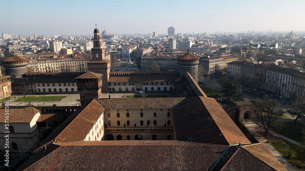 Obraz premium EUROPE, ITALY MILAN 2023 - Drone aerial view from Sforza Castle in Sempione park with skyline of the city in downtown - Via Dante and Duomo cathedral 