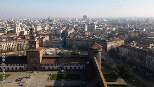 EUROPE, ITALY MILAN 2023 - Drone aerial view from Sforza Castle in Sempione park with skyline of the city in downtown - Via Dante and Duomo cathedral 