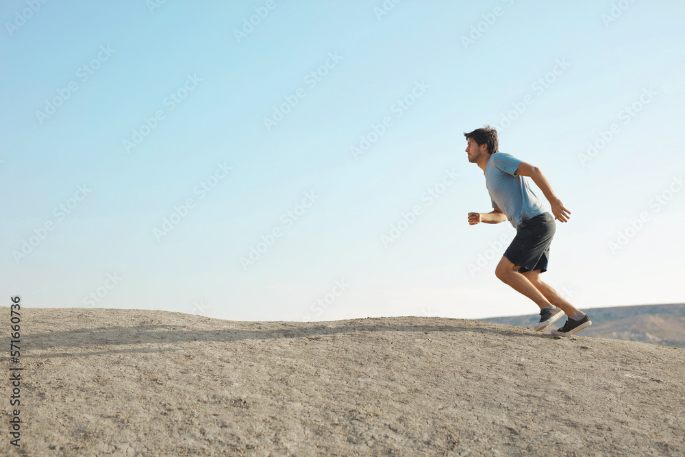 man runs in the desert