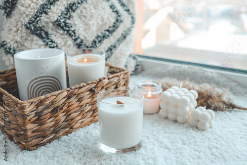 Photos Burning candle in cozy home interior