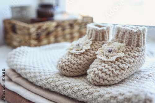 Handmade knitted socks for a newborn close-up © shine.graphics