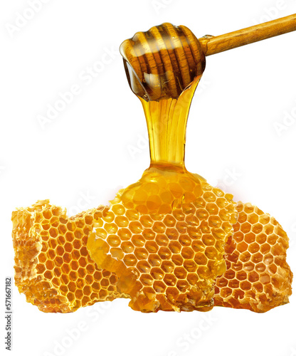favo de mel com pegador de mel de madeira photo