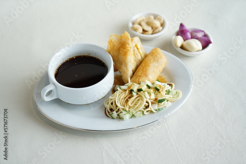 Pempek Palembang, served with Kuah Cuko or Vinegar Sauce and diced cucumbers. Is a savory Indonesian fishcake delicacy, made of fish and tapioca. Palembang Culinary, South Sumatra
