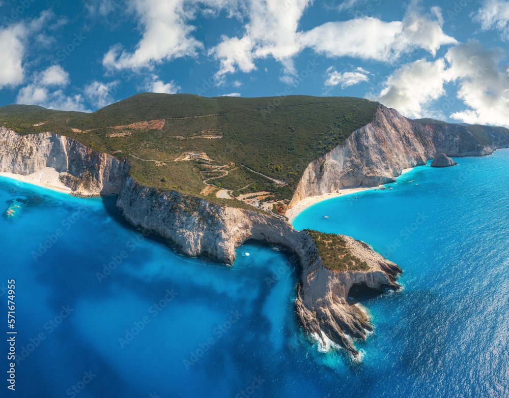 Aerial view of blue sea, mountains, sandy beach at sunny day in summer. Panorama. Porto Katsiki, Lefkada island, Greece. Beautiful landscape with sea coast, rocks, water, sky with clouds. Drone view - obrazy, fototapety, plakaty 