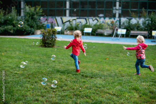toddle baby girls play bubble at Spring garden 