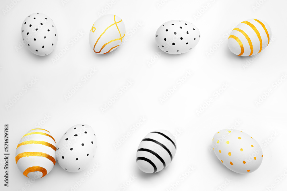 Fototapeta premium Greeting card with space for text. Chicken egg on white background. Minimalistic gold and black pattern. Preparation for religious holiday. Happy Easter. Drawing from stripes and dots. Copyspace