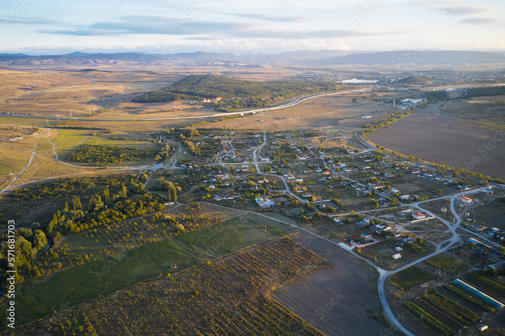 Panoramic aerial view of the countryside on the steppe with vineyards orchards and vegetable gardens.