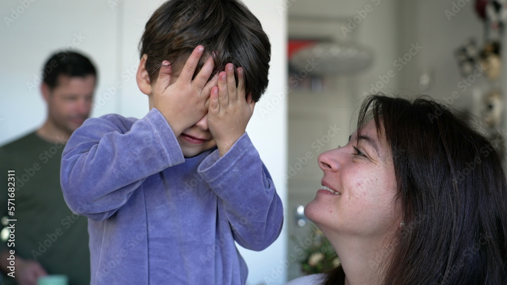 Cute little boy covering face with hands. Introvert adorable kid hiding from camera. Candid authentic lifestyle moment Cute little boy covering face with hands. Introvert adorable kid hiding from camera. Candid authentic lifestyle moment