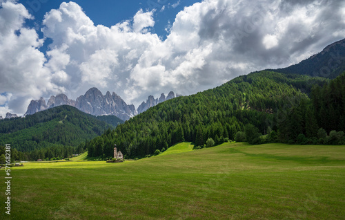 Great view of the Dolomites. Santa Maddalena village, St. Johann Church, Dolomites, Val di Funes, Italy.