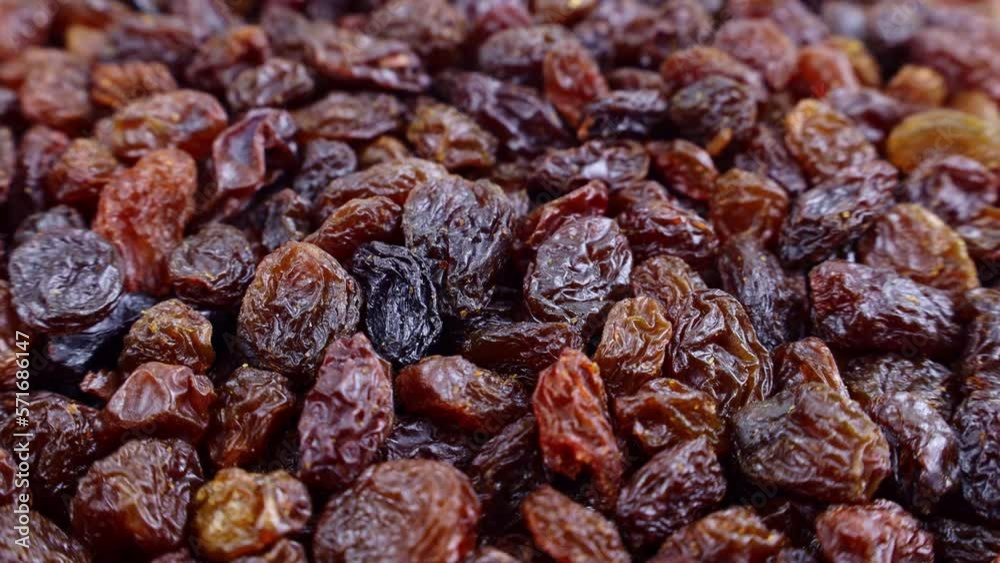 Brown raisins (dried yellow grape) texture circle rotation close up Brown raisins (dried yellow grape) texture circle rotation close up