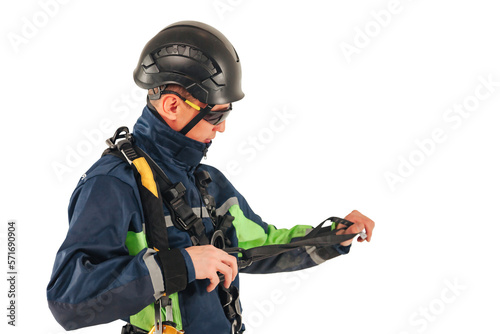 Industrial mountaineering worker in uniform and sunglasses with equipment on white empty isolated background. Rope access laborer posing. Concept of industry urban works. Copy text space advertising