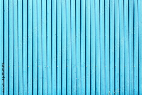 Metal corrugated sheets and metal mesh used for fences. Elements of doors and locks. Background.