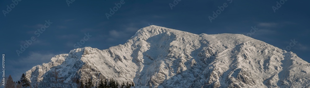 Big snowy hills near Spital am Pyhrn in winter cold evening