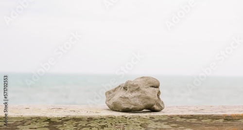 Canvas Print beach rock with ocean in background