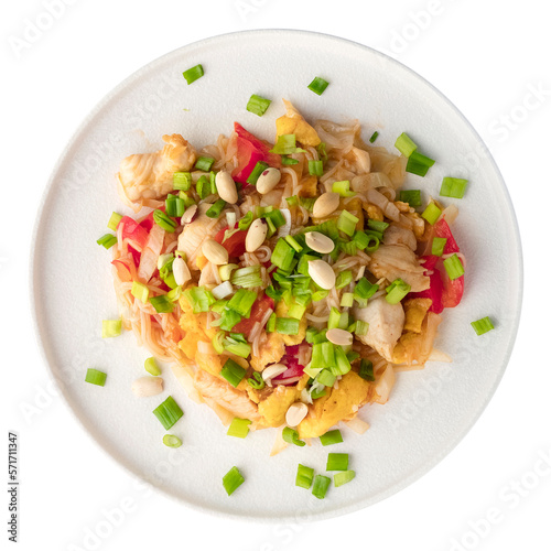 Fried chicken pieces with rice noodles and vegetables on a white plate. Isolated object on a transparent background. Asian food concept. top view