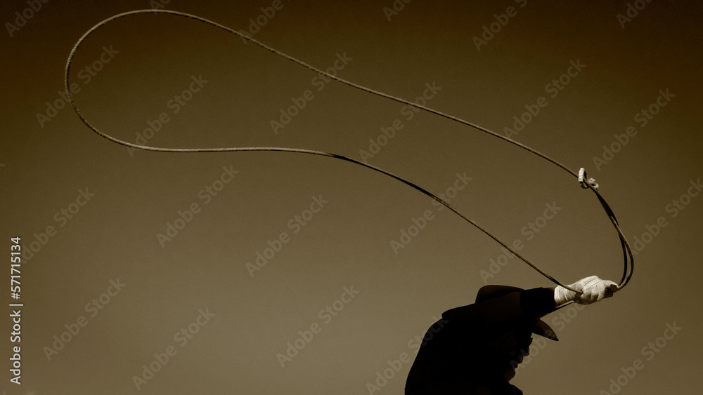Αυτοκόλλητο A sepia picture of a cowboy silhouette with a lasso