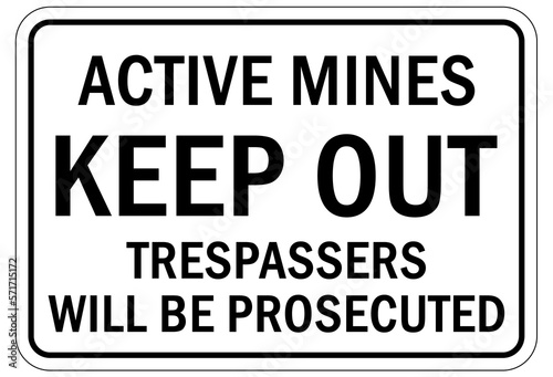 Active mine site warning sign and labels keep out. trespasser will be prosecuted