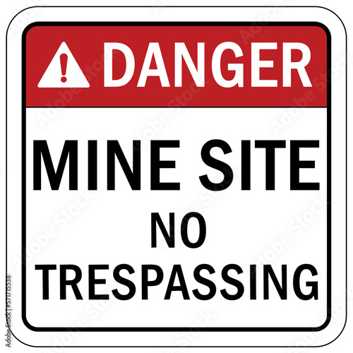 Active mine site warning sign and labels no trespassing