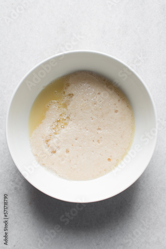 Activated yeast with water and melted butter, dry yeast granules on water, foamy yeast
