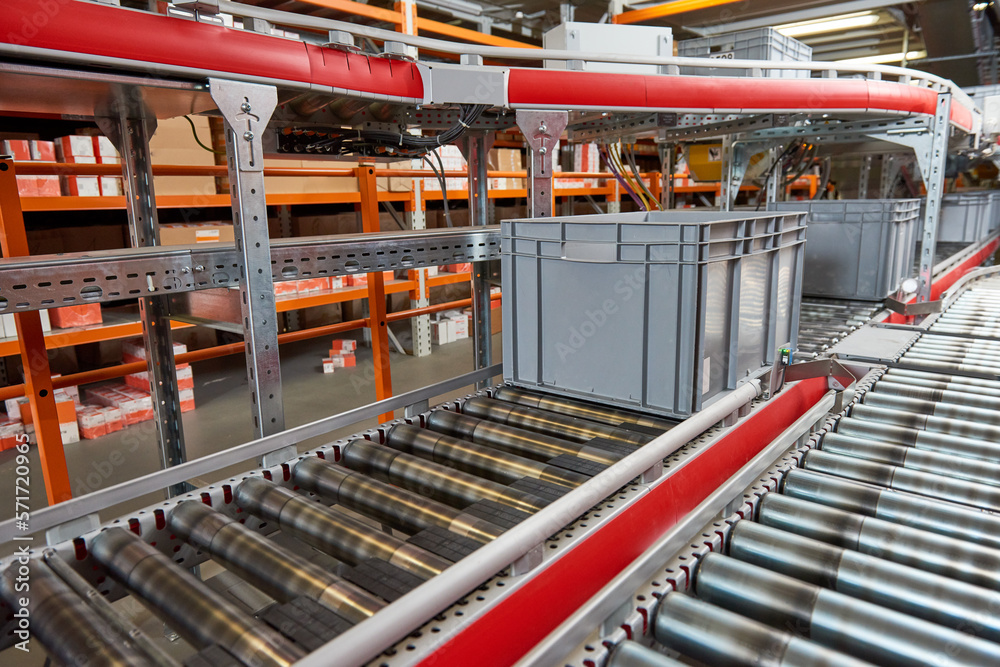 Automated warehouse. Boxes with spare parts moving on conveyer. smart logistics
