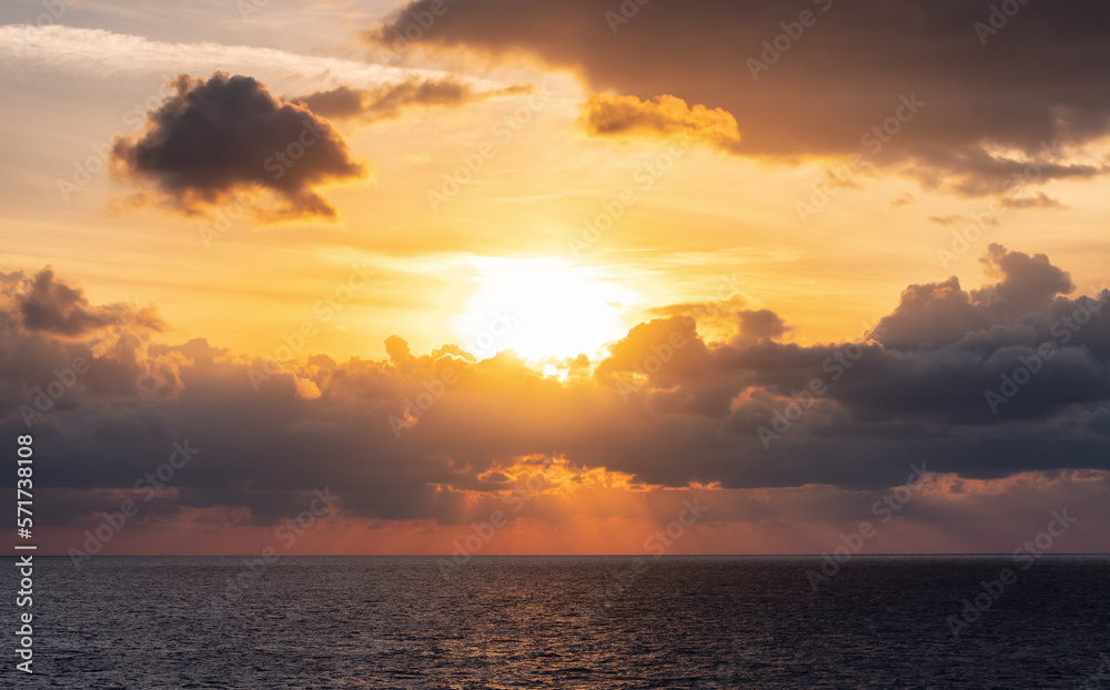 Fototapeta premium Dramatic Colorful Sunset Sky over Mediterranean Sea. Clouds with Sunrays. Cloudscape Nature Background.