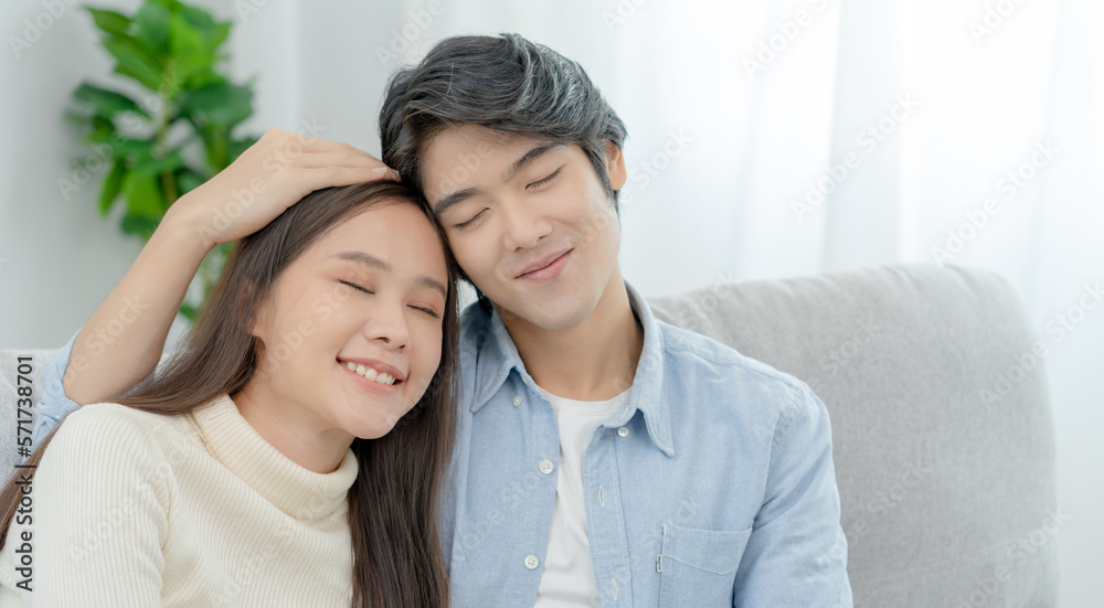 Asian couple smile and happy hug each other's eyes, cuddling, warm hugs, teenager's first love, married couple, warm family. Husband and wife in love so fun in new years eve or valentine day Asian couple smile and happy hug each other's eyes, cuddling, warm hugs, teenager's first love, married couple, warm family. Husband and wife in love so fun in new years eve or valentine day