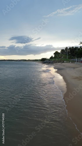 Imagem aérea do por do sol e início da noite na Enseada de Meaípe, no litoral sul de Guarapari no Espírito santo, próximo a hotéis, pousadas e restaurantes. photo