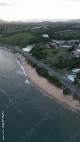 Imagem aérea do por do sol e início da noite na Enseada de Meaípe, no litoral sul de Guarapari no Espírito santo, próximo a hotéis, pousadas e restaurantes. photo