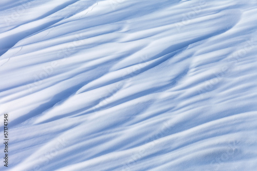 Abstract snow natural winter texture of snowy crust on ice of frozen Baikal Lake in cold day. White and blue unusual textured background, blank, mock up, flat lay, copy space