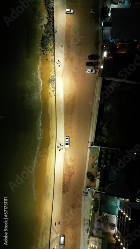 Imagem aérea do por do sol e início da noite na Enseada de Meaípe, no litoral sul de Guarapari no Espírito santo, próximo a hotéis, pousadas e restaurantes. photo