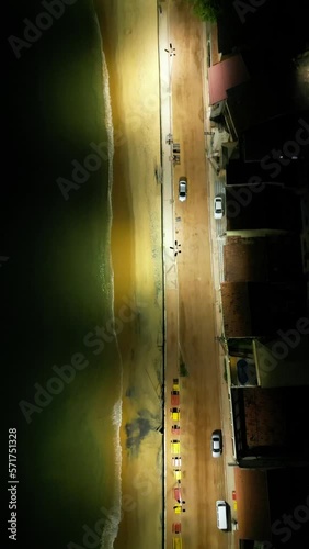 Imagem aérea do por do sol e início da noite na Enseada de Meaípe, no litoral sul de Guarapari no Espírito santo, próximo a hotéis, pousadas e restaurantes. photo