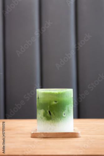 Iced matcha greentea on wooden table