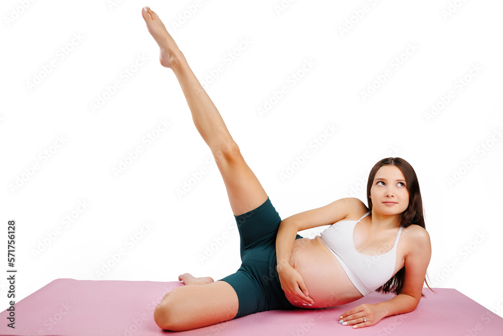 Full length of a caucasian young pregnant woman in boxers and top training, isolated over white background Full length of a caucasian young pregnant woman in boxers and top training, isolated over white background