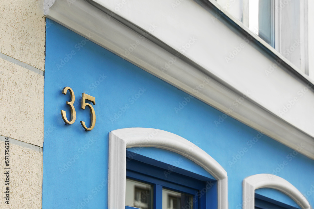 Plate with house number thirty five on beautiful building outdoors