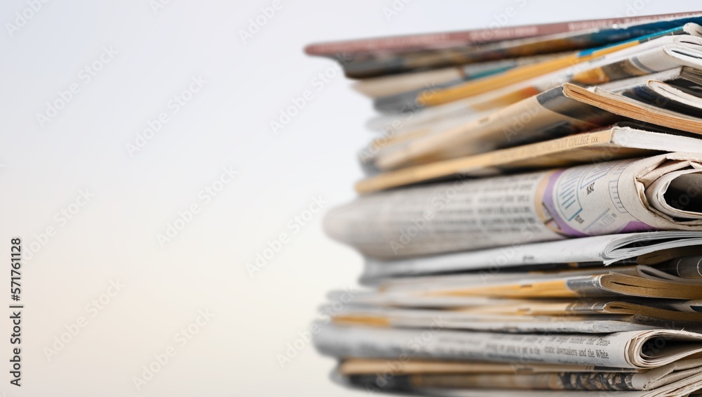 A pile of dusty, old magazines on background A pile of dusty, old magazines on background