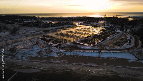 The Beachwood Neighborhood off the Channel of Muskegon Lake during a dazzling Winter Sunset. photo