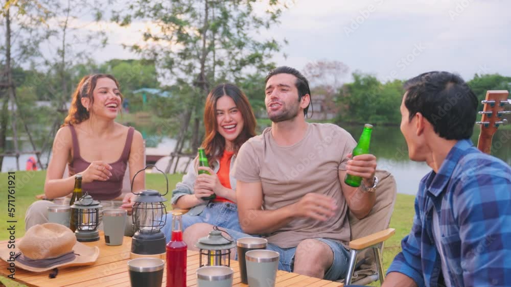 Group of diverse friend having outdoors camping party together in tent Group of diverse friend having outdoors camping party together in tent