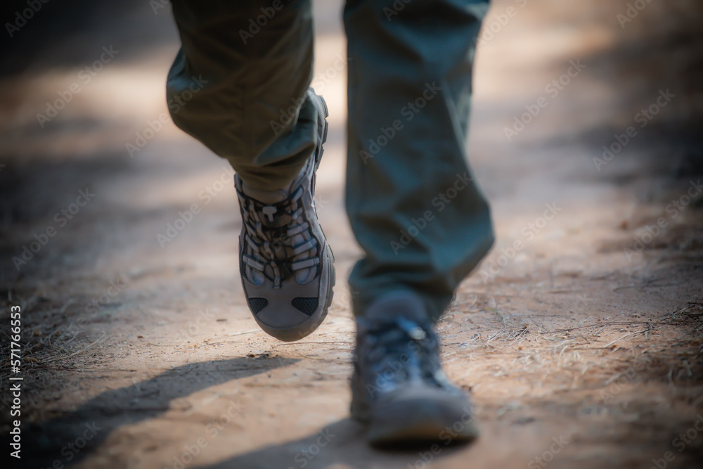 foot of woman Traveler with backpack relaxing outdoor with rocky mountains on background Summer vacations and Lifestyle hiking concept.