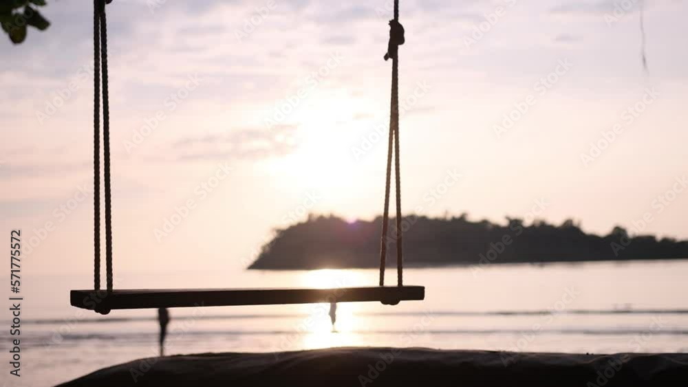 Tropical Beach Empty Swing during Sunset. Paradise Destination Exotic Holiday Concept Tropical Beach Empty Swing during Sunset. Paradise Destination Exotic Holiday Concept