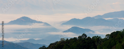 Tranquil morning landscape over the foggy mountains.