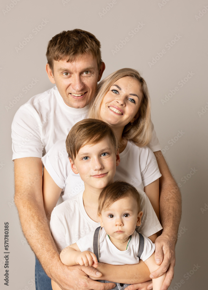 family with children on gray background