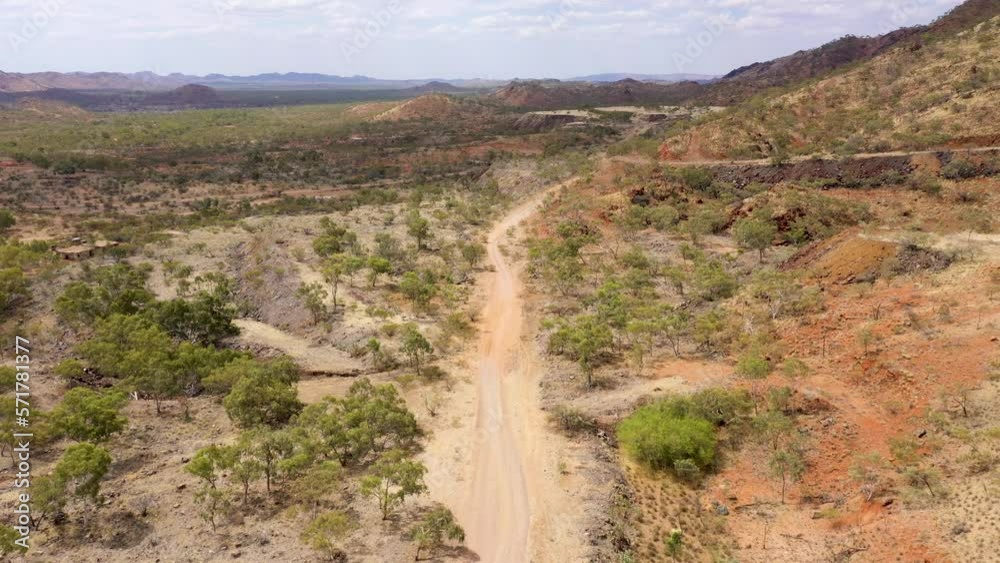 Arid dry landscape with dirt road aerial in Outback Queensland, Australia Arid dry landscape with dirt road aerial in Outback Queensland, Australia