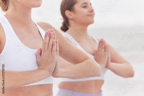 Yoga, meditation and women with hands together, fitness or practice for balance, healthy lifestyle or wellness. Females, ladies or gesture for peace, pilates training or exercise to relax and outdoor