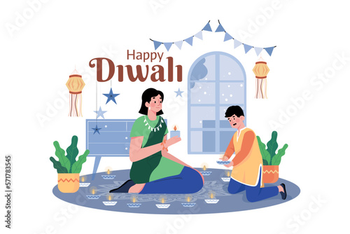 Indian boy and mother holding oil lamps for Diwali celebration
