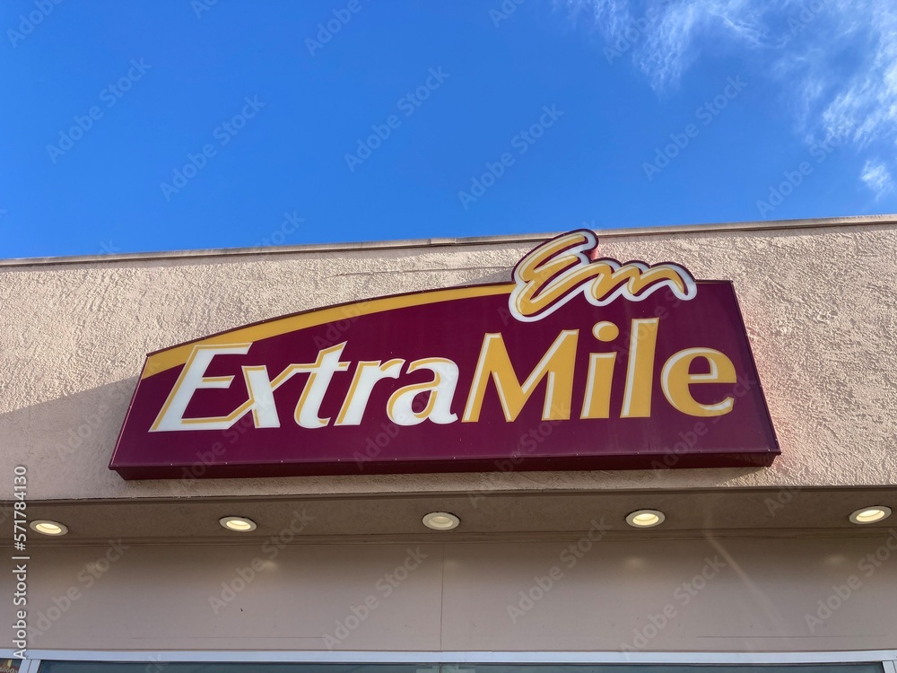 Chevron ExtraMile convenience store sign, logo above the entrance to