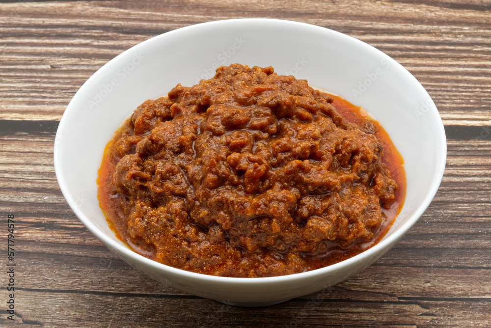 Ragù alla Bolognese on wooden table. Traditional Italian cuisine. Ragù alla Bolognese on wooden table. Traditional Italian cuisine.