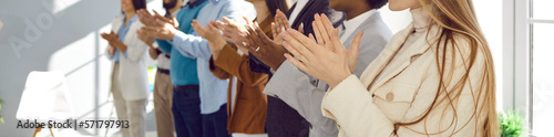 Group of business people clapping hands at public conference. Multiracial male and female audience giving round of applause to express respect and gratitude to interesting speaker. Header background