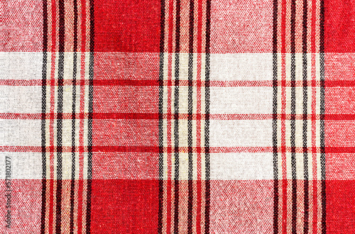 Red fabric with vertical and horizontal stripes of different widths