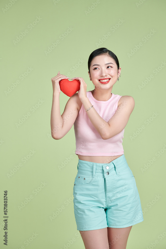 Red heart symbol of Valentines day smiling woman hold. Red heart symbol of Valentines day smiling woman hold.