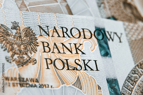 Close up on national polish bank of new Polish banknote. Macro photo of narodowy bank polski sign on PLN bill. Shallow focus. Close-up with fine and sharp texture